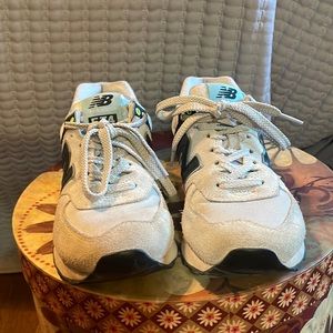Women’s. Size 7. New Balance 574 athletic shoes.